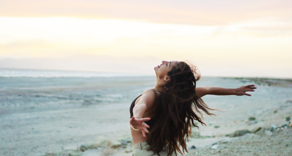 Woman in front of the beach